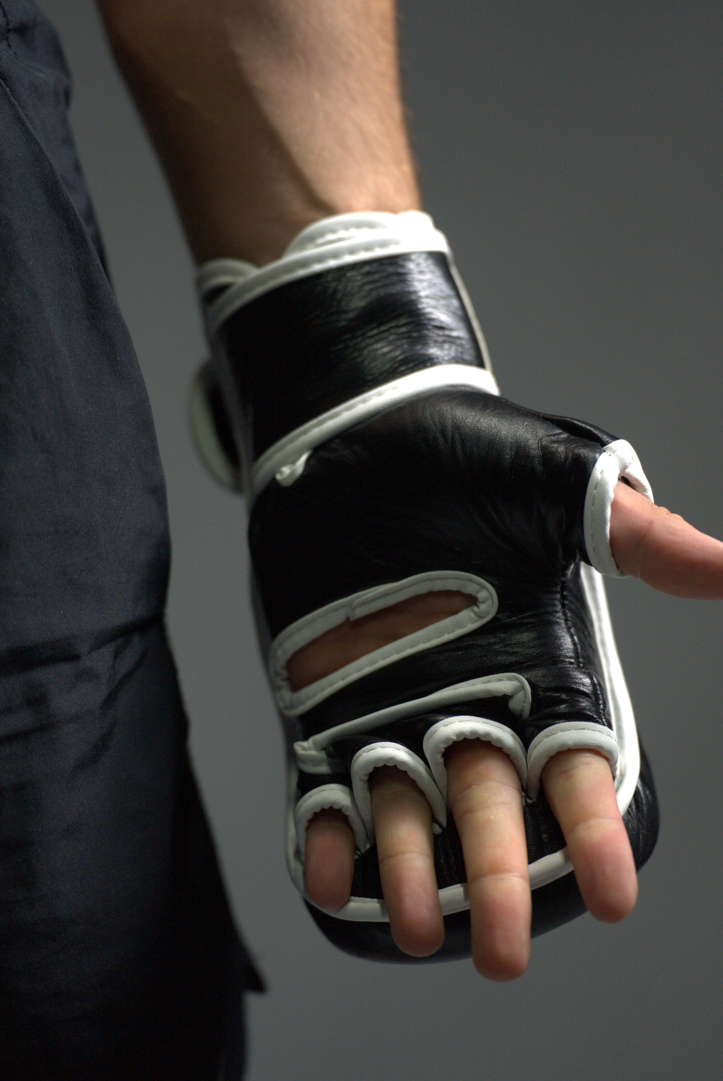 Black MMA sparring gloves focusing on the inside
